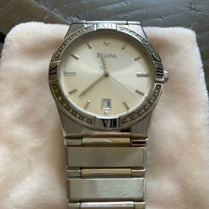 Bulova ladies large watch with diamonds around face